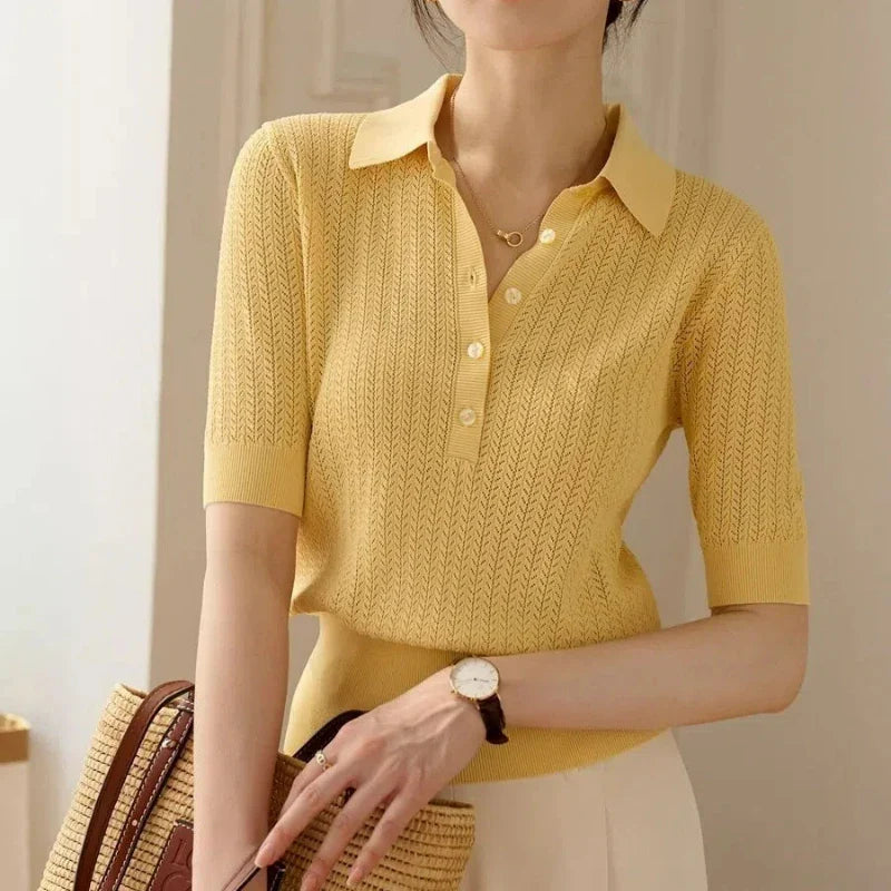 FJØRNA ribbed knit polo blouse for women, showcasing a close-up of the fitted, textured ribbed fabric and classic collar design.