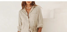 FJØRNA women's linen top with ruffle detail, showcasing a lightweight, stylish blouse perfect for warm weather.