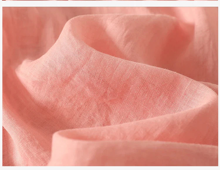 FJØRNA women's cotton V-neck blouse, stylish and comfortable tops for women, shown in a close-up image.