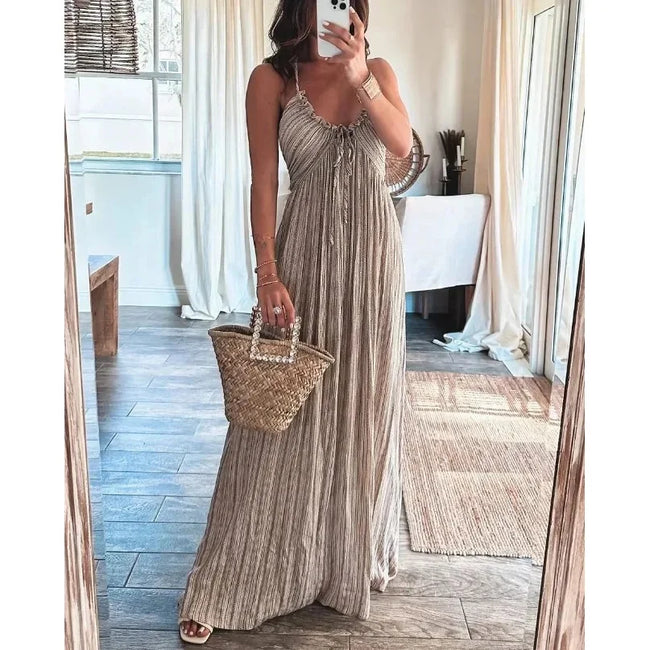 FJØRNA Renly white sleeveless long dress with flowing fabric, elegant design, and full-length silhouette.
