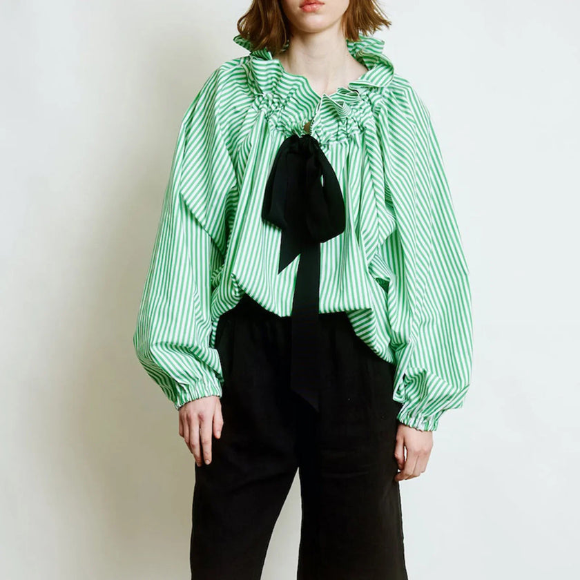 FJØRNA women's cotton blouse featuring ruffle detail, lightweight and stylish top, ideal for casual or dressy outfits