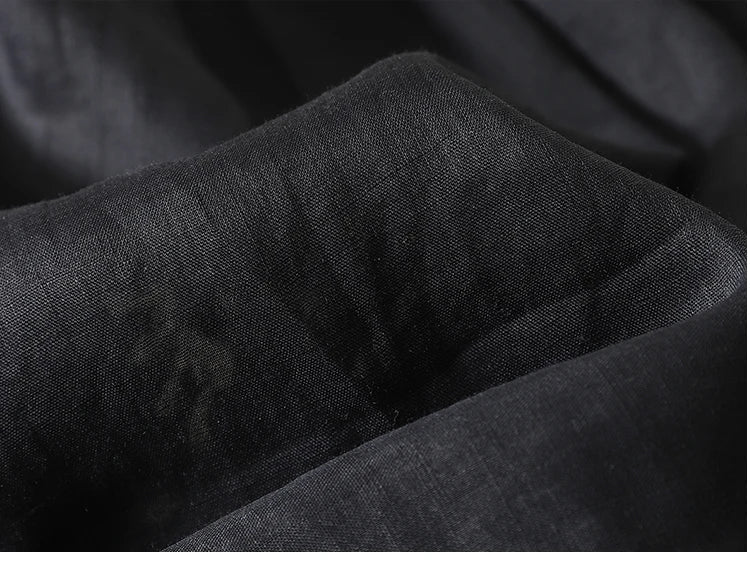 FJØRNA women's cotton V-neck blouse, featuring a stylish and comfortable top for women, displayed in a natural pose.
