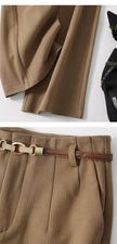 FJØRNA women's wool wide-leg high-waist trousers, tailored pants with a relaxed fit and classic design, shown on a model.