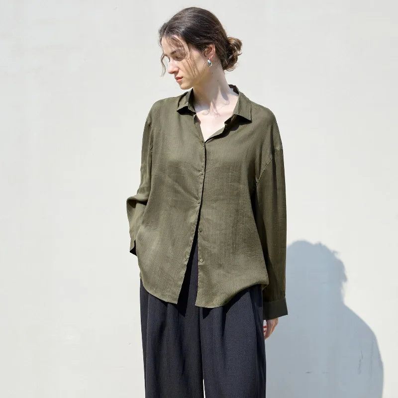 Light beige FJØRNA linen shirt for women, stylish top with a relaxed fit, short sleeves, and natural fabric texture.