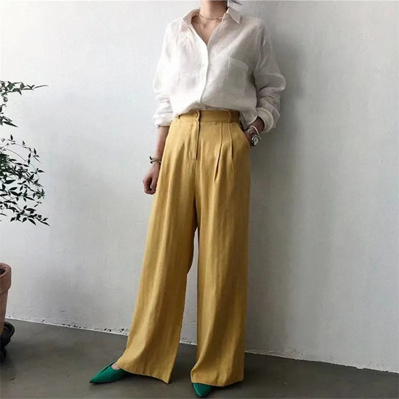FJØRNA women's linen shirt with open collar, lightweight and breathable top, shown on a model.