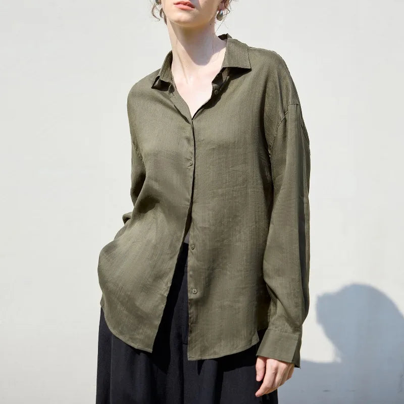 FJØRNA women's linen shirt, lightweight and breathable, shown in a relaxed fit with long sleeves and classic collar.