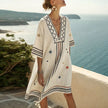 FJØRNA summer floral maxi dress for women with V-neck, flowing fabric, displaying a vibrant floral pattern and sleeveless design.