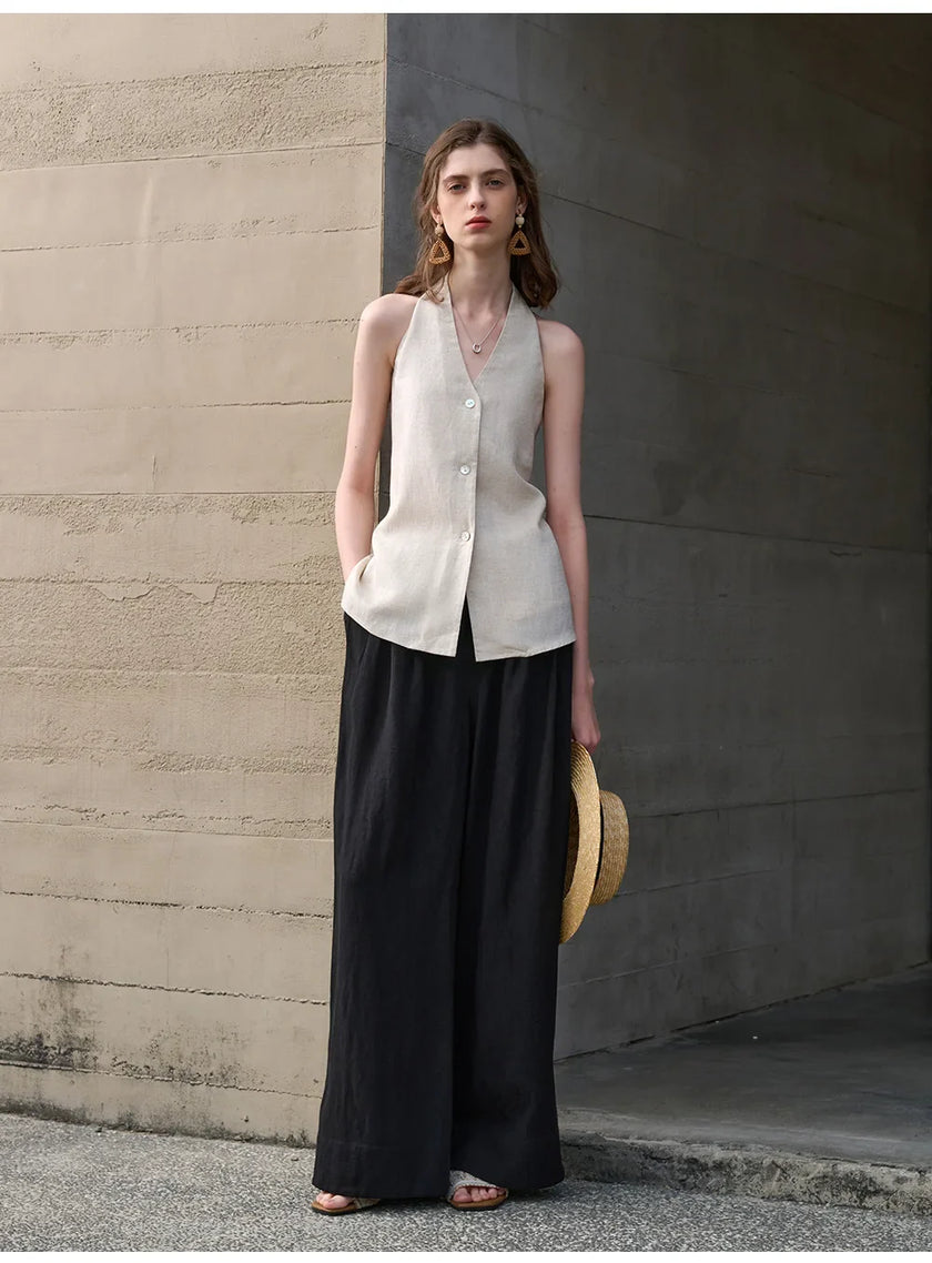 FJØRNA women's linen waistcoat with halter neck and sleeveless design, shown as a stylish top in a natural fabric look.