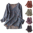 FJØRNA Kaien wrap-style blouse in soft fabric with long sleeves and V-neck, shown on a hanger against a neutral background.