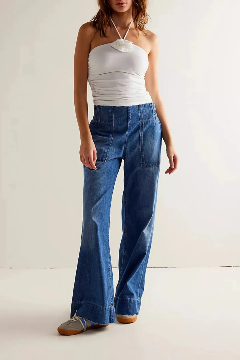 FJØRNA women's wide-leg denim jeans with a relaxed fit, showcasing the classic blue denim fabric and stylish silhouette.