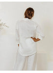 Extra-large linen shirt with spacious pockets by FJØRNA, featuring a relaxed fit and natural fabric texture.