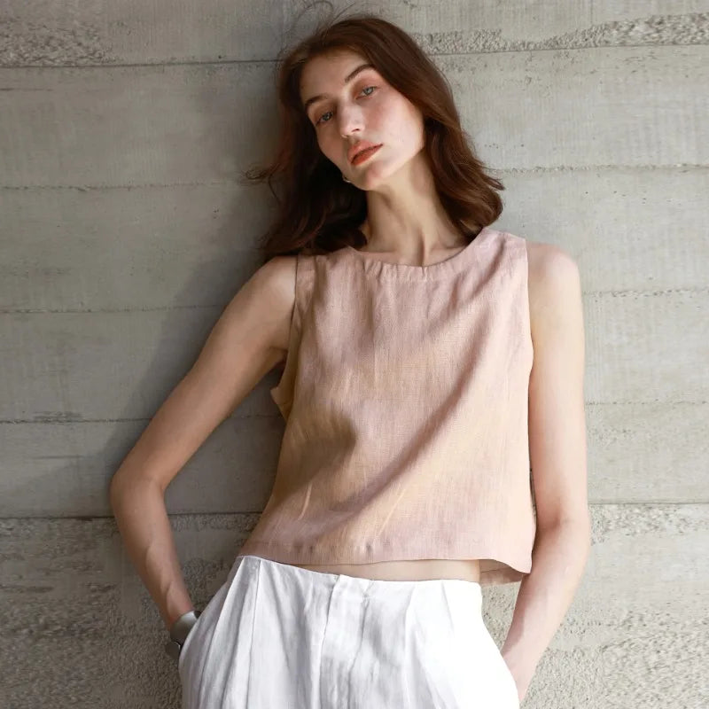 FJØRNA women’s linen crop top, lightweight and stylish, shown in a natural pose, highlighting the breathable fabric and cropped fit.