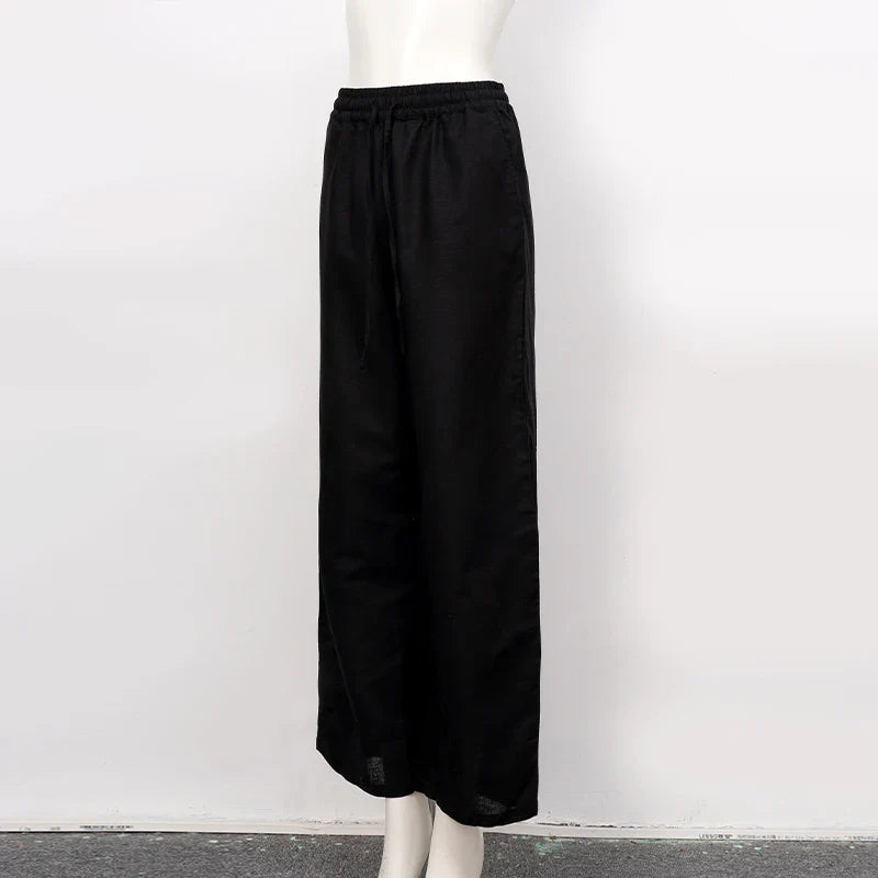 FJØRNA women's cotton linen wide leg trousers with drawstring pull-on design, showcasing relaxed fit and breathable fabric.