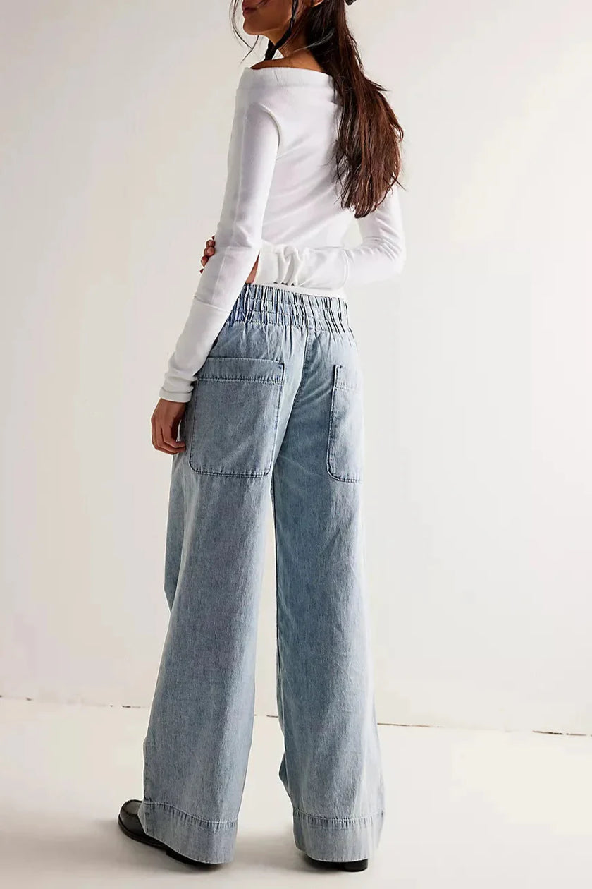Women’s wide-leg denim jeans by FJØRNA, casual pants with a relaxed fit and classic blue denim wash.