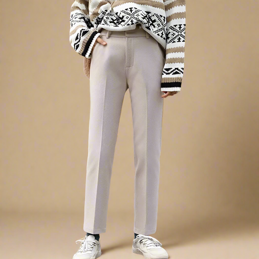 FJØRNA women's wool blend trousers, stylish and tailored pants with a classic fit, shown on a model with a neutral background.