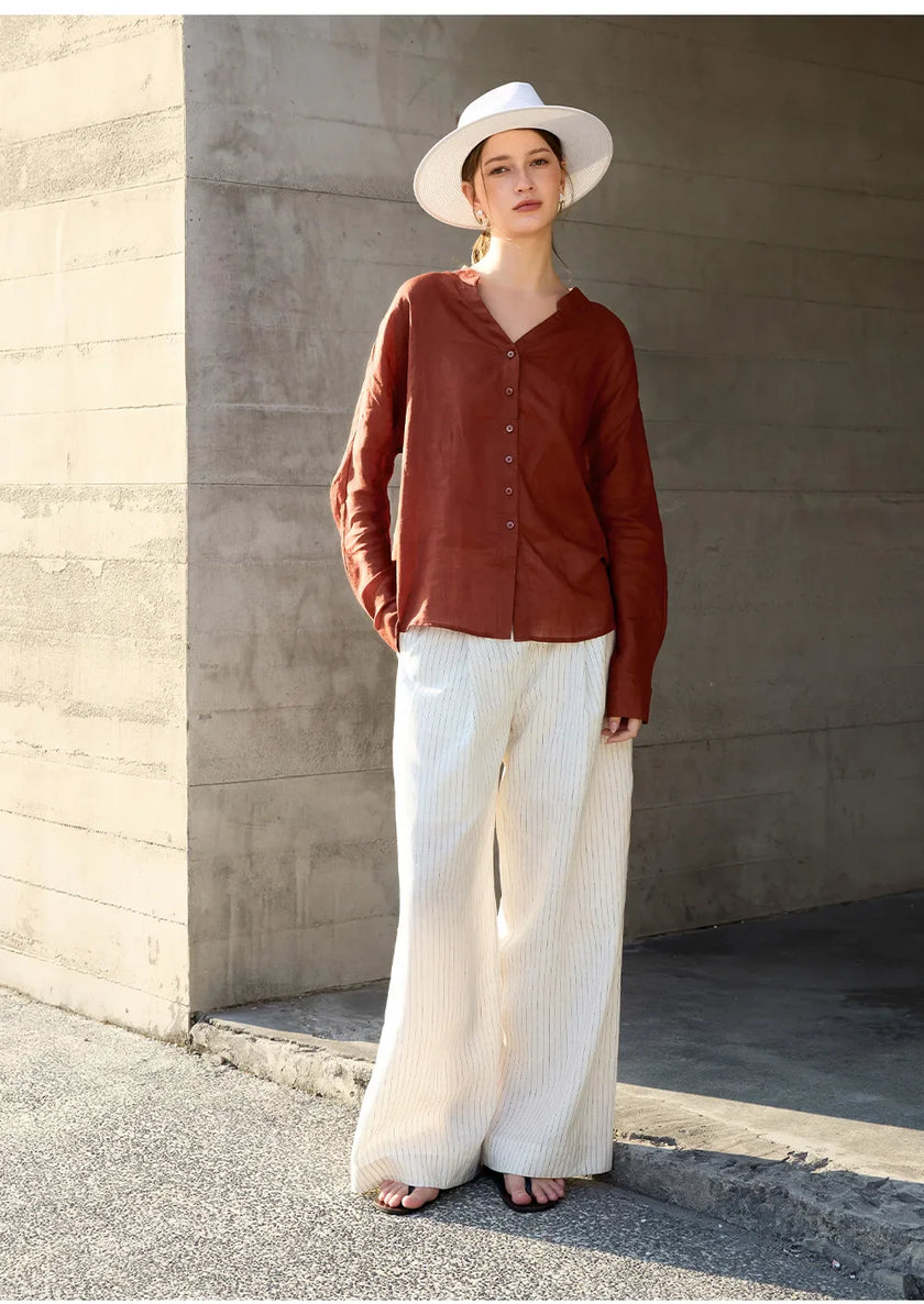 FJØRNA women's linen V-neck shirt, lightweight and breathable top, shown in a natural fit with soft fabric and classic V-neck design.