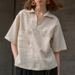 FJØRNA linen polo blouse for women with open collar, lightweight and breathable top perfect for casual and summer wear.