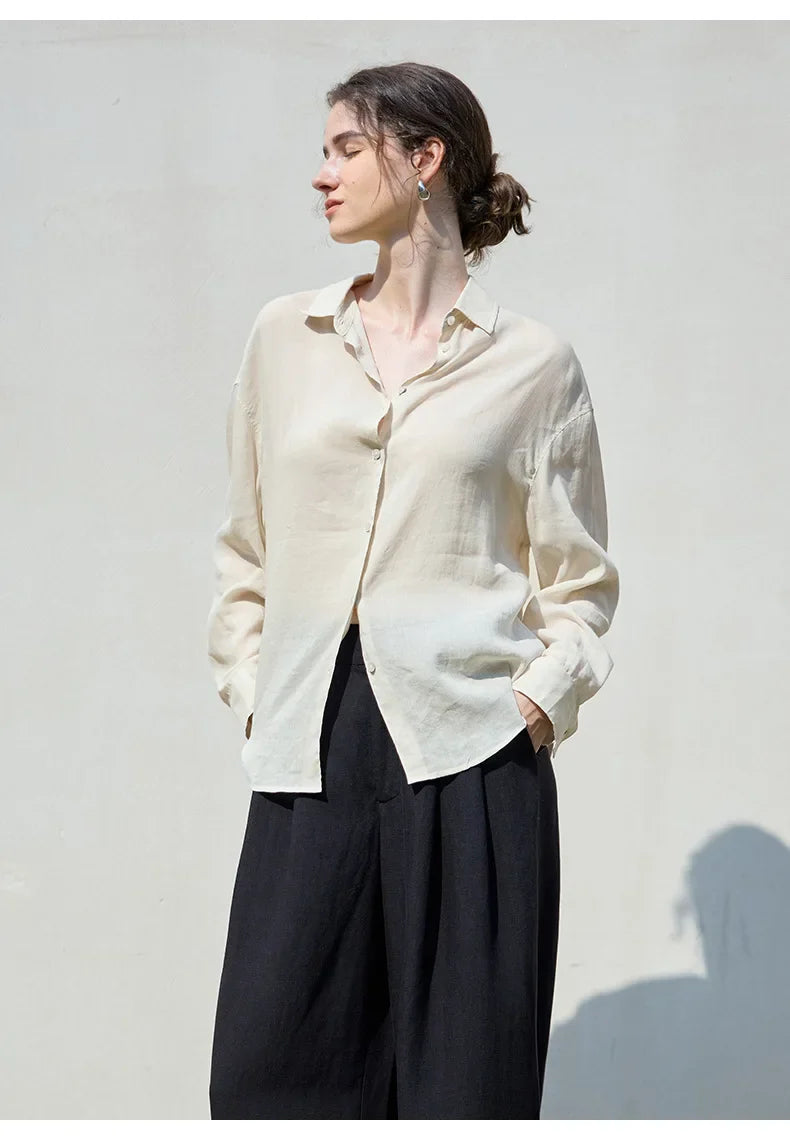FJØRNA women's linen shirt, lightweight and breathable tops for women, shown in a relaxed fit with collar and button front.