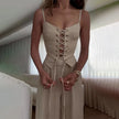FJØRNA women's sleeveless linen dress showing lightweight fabric, relaxed fit, and simple elegant design for warm weather.