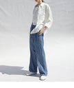 FJØRNA women's long sleeve linen blouse with a relaxed fit and natural fabric texture, perfect for casual or office wear.