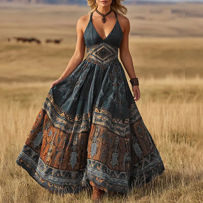 FJØRNA Calisara printed empire waist maxi dress in white with floral patterns, flowing fabric, and a relaxed fit.