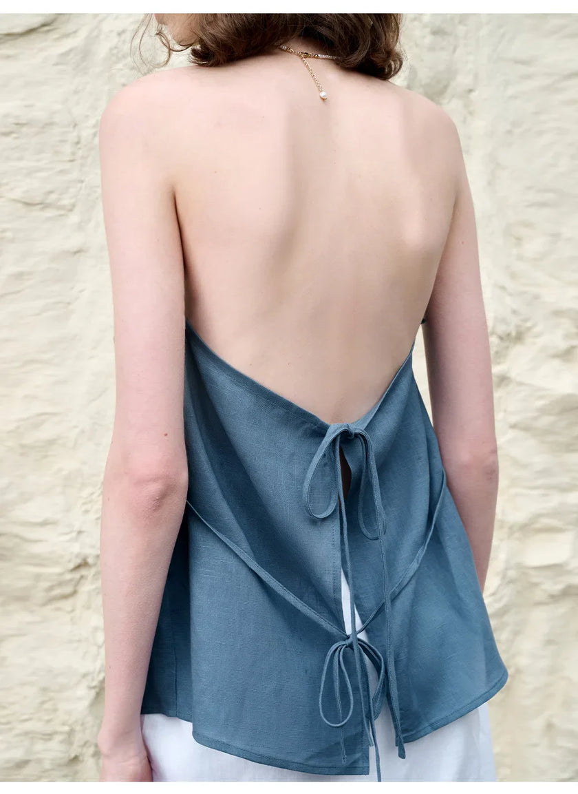 FJØRNA women's linen waistcoat with halter neck and sleeveless design, styled as a lightweight, elegant top for warm weather.