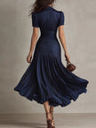 FJØRNA Zaffira White Pleated Midi Dress with flowing fabric and elegant midi length, perfect for stylish occasions.