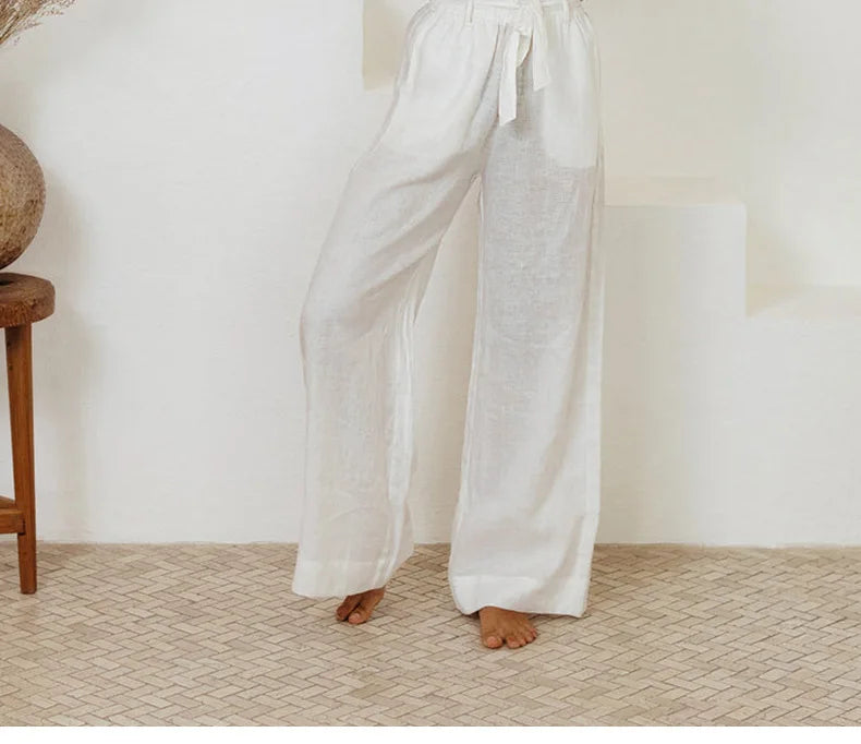 Women’s linen top with ruffle details by FJØRNA, featuring a lightweight, breezy design perfect for casual or summer wear.