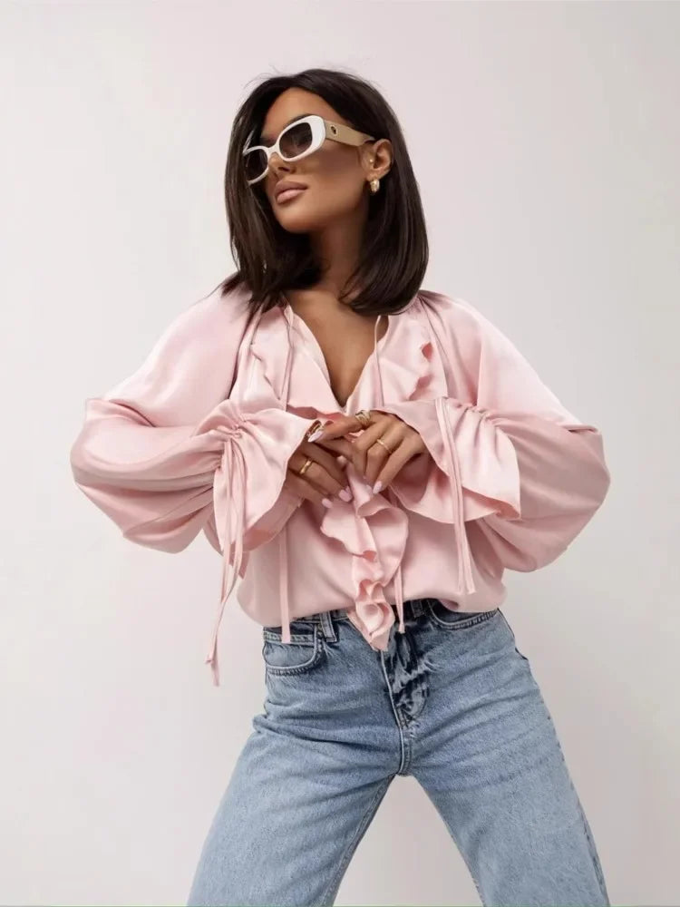 FJØRNA satin blouse for women with ruffle detail, stylish top featuring smooth fabric and elegant design.