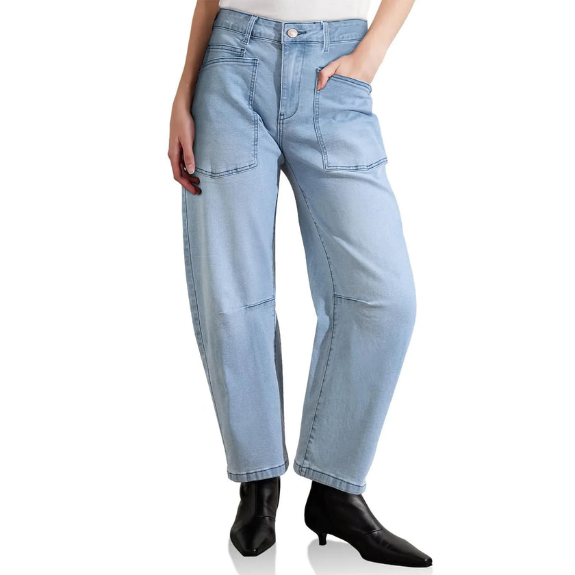 Women’s denim jeans with a barrel leg style by FJØRNA, showcasing classic blue denim fabric and relaxed fit.