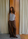 Women’s linen blend wide leg trousers with high waist from FJØRNA, styled with a relaxed fit and natural fabric texture.