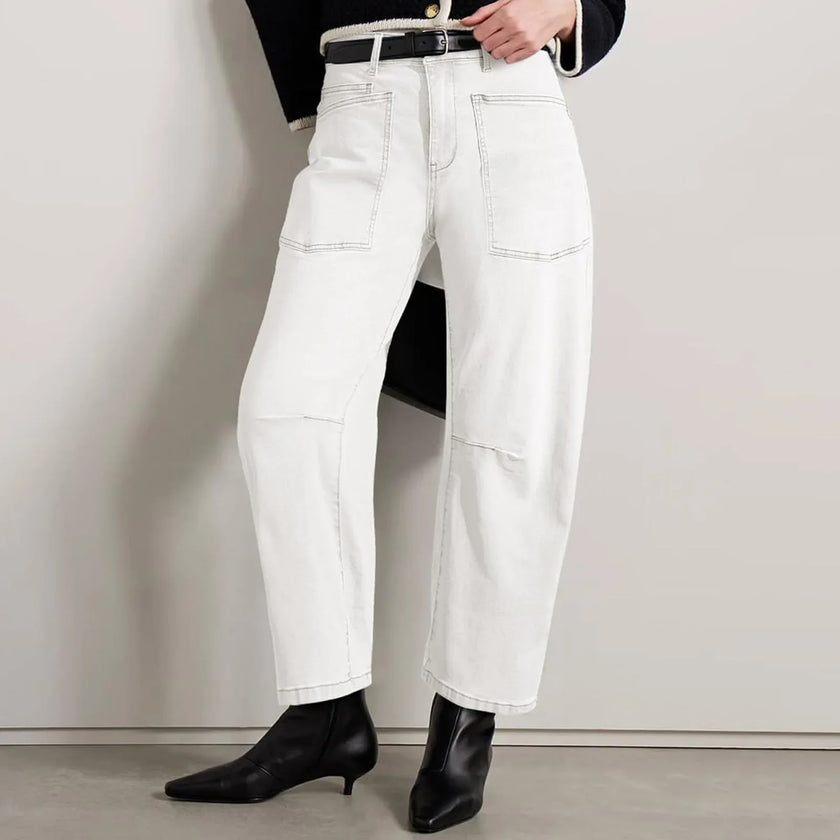 FJØRNA women's denim jeans with barrel leg style, showcasing a classic fit and durable indigo denim fabric.