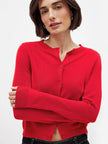 FJØRNA women's knit cardigan, soft and cozy, featuring a button-up front and ribbed cuffs, worn as a stylish top.