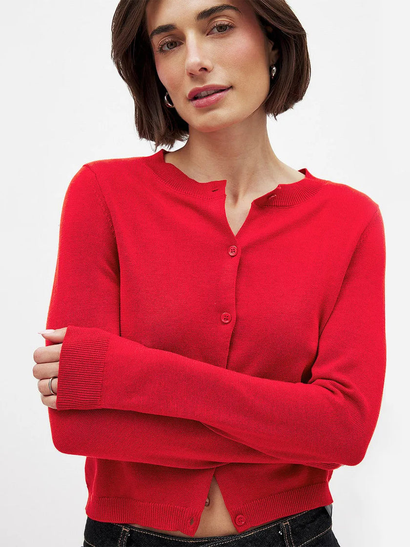FJØRNA women's knit cardigan, soft and cozy, featuring a button-up front and ribbed cuffs, worn as a stylish top.