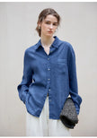 FJØRNA women's linen blend shirt, stylish casual top with a relaxed fit, featuring a button-up front and soft fabric texture.
