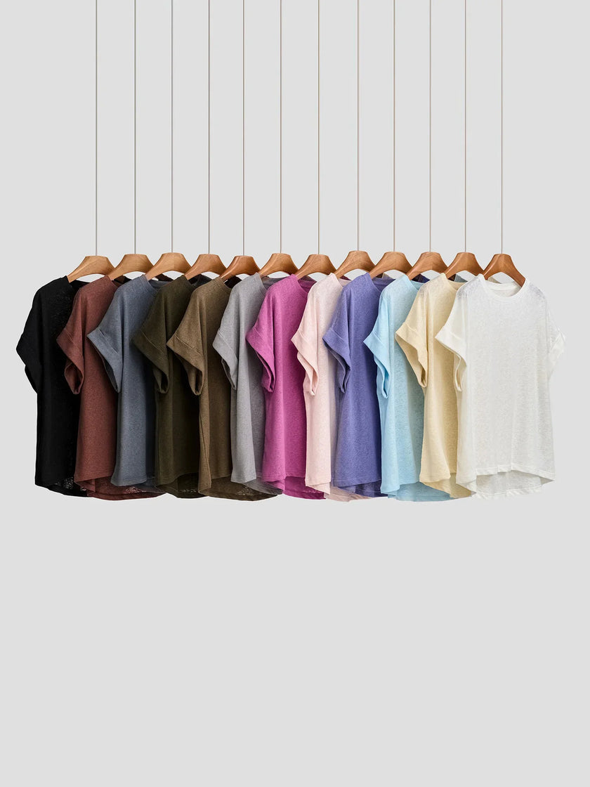 FJØRNA oversized tee with rolled cuffs, casual fit, soft fabric, featuring a relaxed style and comfortable design.
