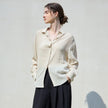 FJØRNA women's linen shirt, lightweight and breathable tops for women, featuring a relaxed fit and natural fabric texture.