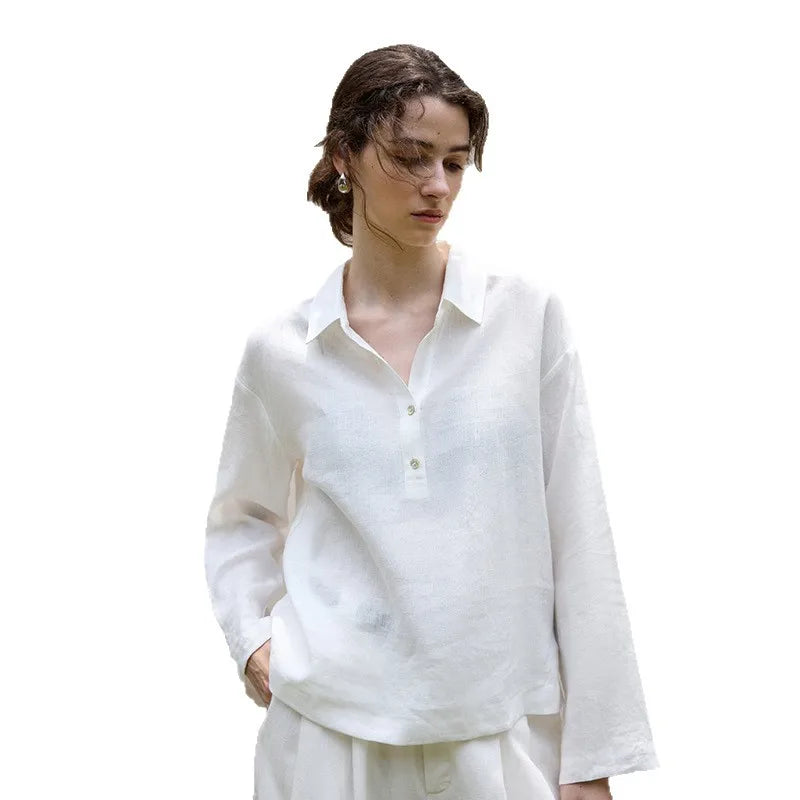 FJØRNA women's linen polo top with collar, showing a close-up of the soft fabric and classic design.