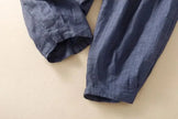 FJØRNA women's linen tapered trousers, lightweight and breathable pants with a relaxed fit, displayed on a neutral background.