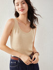 FJØRNA women's cashmere top, soft and cozy, in a neutral color, showcasing a stylish fit and smooth texture.