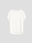 FJØRNA oversized tee with rolled cuffs, soft cotton fabric, relaxed fit, and casual style, shown on a model.