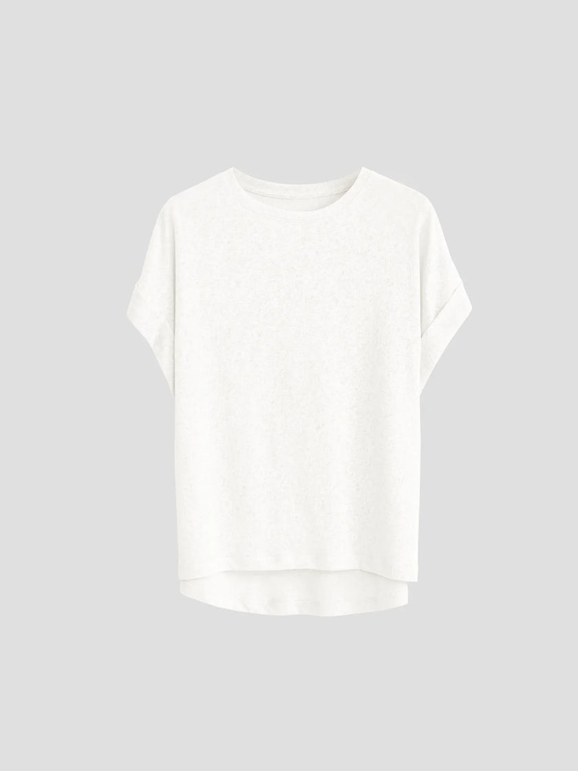 FJØRNA oversized tee with rolled cuffs, soft cotton fabric, relaxed fit, and casual style, shown on a model.