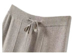 FJØRNA women's merino wool wide-leg high-waist trousers, stylish and comfortable pants, natural fiber fabric, neutral color.