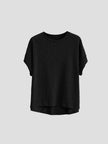 FJØRNA oversized T-shirt with rolled cuffs, relaxed fit, soft fabric, and casual style, shown on a model.