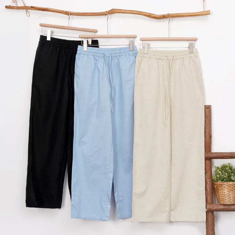Women’s cotton linen wide leg trousers with drawstring waist by FJØRNA, featuring a relaxed fit and pull-on style.