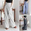 FJØRNA women's cotton wide-leg high-waist trousers with relaxed fit and tailored style, displayed on a model.