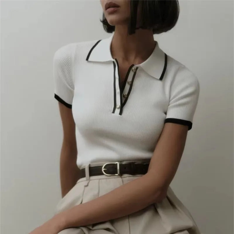 FJØRNA women's cotton polo top, lightweight and classic design, featuring a collared neckline and short sleeves.