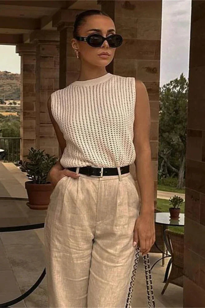 FJØRNA women's sleeveless knit tank top, soft and fitted, shown in a close-up of the beige top against a neutral background.