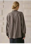 FJØRNA women's linen blend shirt, stylish and lightweight top with a relaxed fit, shown in a natural fabric texture.