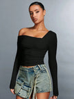 FJØRNA women's off-shoulder cotton top with a relaxed fit, featuring a stylish neckline and lightweight fabric.